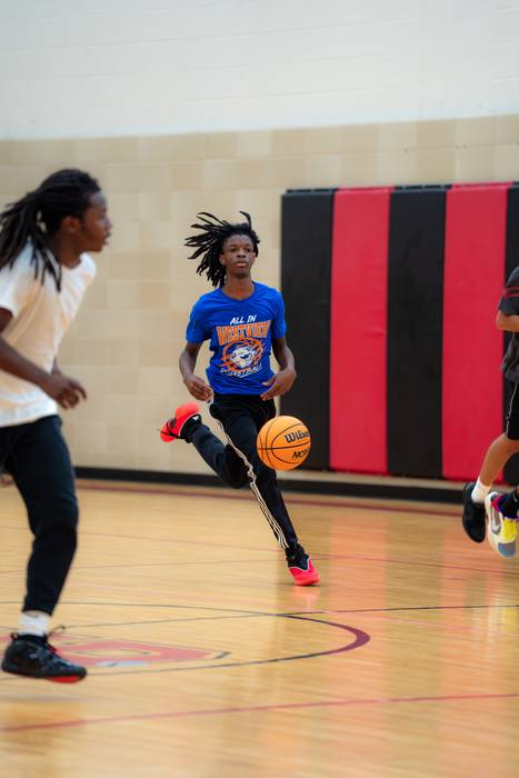 Players running the floor on a fast break