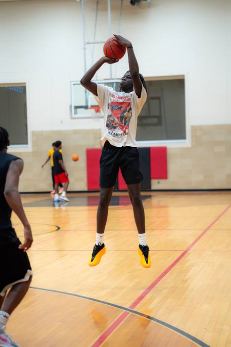 Player rising for a jump shot